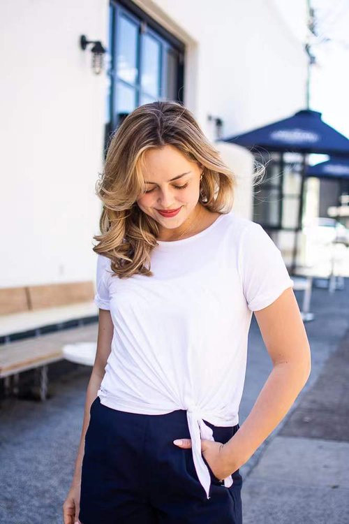 Ladies white modal top with side knot detail. short sleeves and round neckline maker her a perfect top of all seasons.