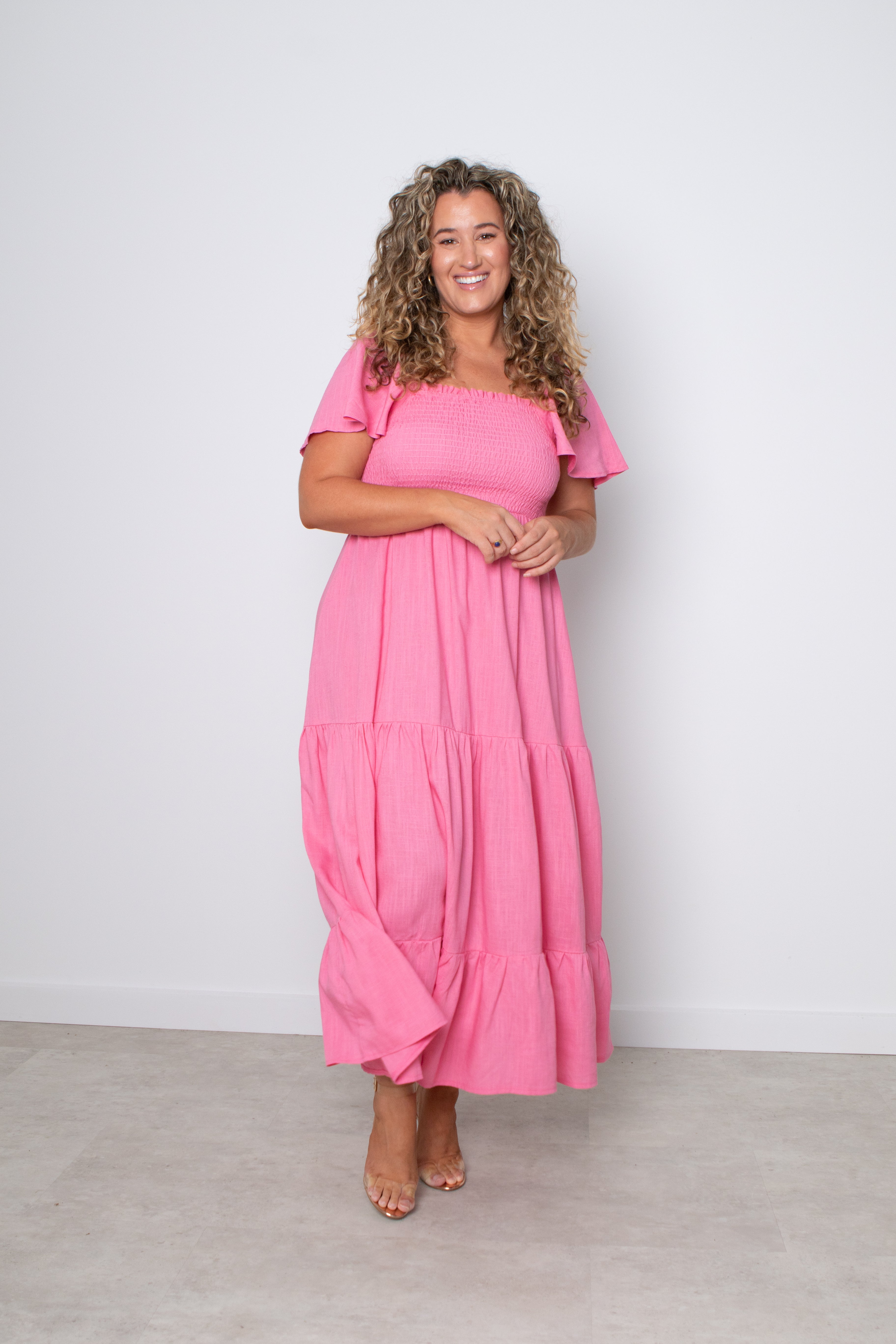 Make a statement in the Alena Dress. Our Alena Dress can be worn on or off the shoulder with a shirred bodice falling into a maxi length dress. The perfect elegant evening outfit or pair her with your fav sneakers for a more causal weekend style. The perfect wedding guest dress or bump friendly dress for pregnant mums.
